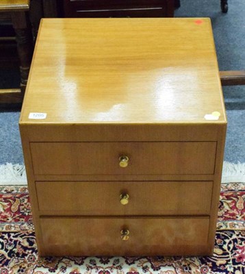 Lot 1205 - A teak bedside chest of drawers