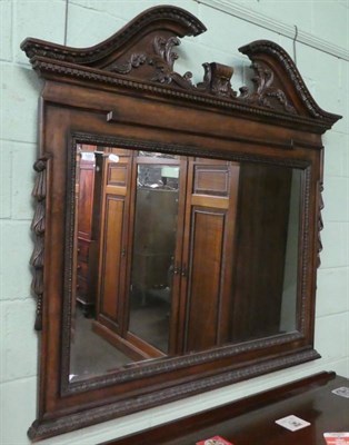 Lot 1207 - A reproduction carved hardwood mirror in the Chippendale style, 132cm high by 130cm wide approx