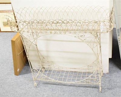 Lot 1213 - A white painted wrought metal plant stand