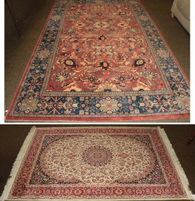 Lot 1222 - Machine made carpet of Feraghan design, 296cm by 200cm; together with a smaller rug (2)