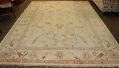 Lot 1226 - Afghan Ziegler carpet, the ivory field if palmettes and vines enclosed by similar borders, 372cm by