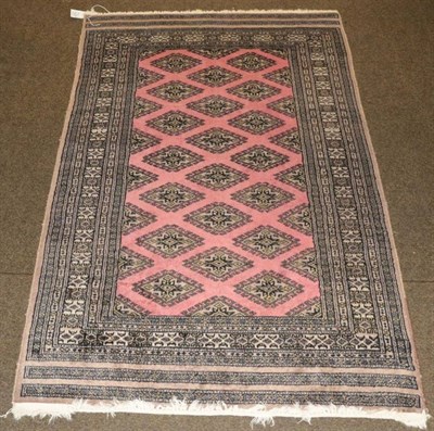 Lot 1227 - Lahore ''Bukhara'' rug, Pakistan, the field of hooked guls enclosed by multiple borders, 147cm...