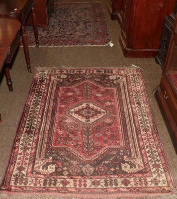 Lot 1229 - Kashgai rug, the raspberry panel field with Memling gul, enclosed by ivory borders, 155cm by 115cm