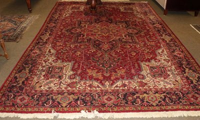 Lot 1232 - Heriz Carpet, Iranian Azerbaijan, the blood red field of angular vines around a flower head...