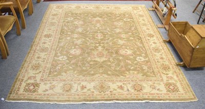 Lot 1236 - Afghan Ziegler rug, the shaded camel field of palmettes and vines enclosed by ivory borders,...