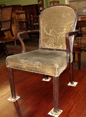 Lot 1263 - A George III carved mahogany open armchair, upholstered in green velvet