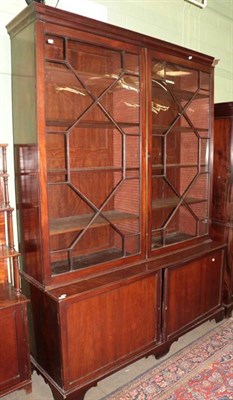 Lot 1274 - A late George III large glazed mahogany bookcase