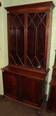 Lot 1276 - A 19th century mahogany astragal glazed bookcase cabinet, probably a marriage