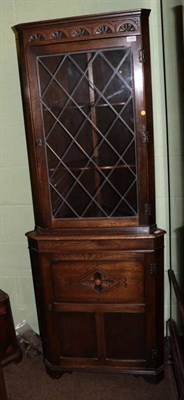 Lot 1280 - A reproduction oak leaded glass corner cupboard, 66cm wide