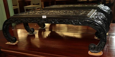 Lot 1283 - A carved and ebonised wood low table, modern