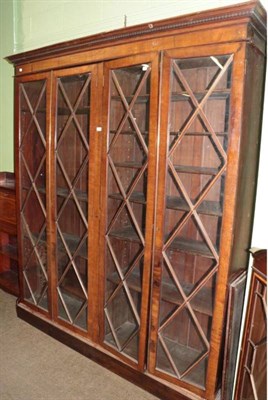 Lot 1286 - A late 19th/early 20th century mahogany four door bookcase with adjustable shelves