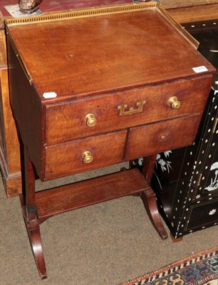 Lot 1290 - A 19th century mahogany three drawer table with brass gallery back