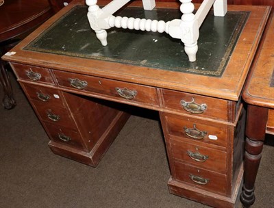 Lot 1295 - A late Victorian walnut kneehole desk with modern leather top