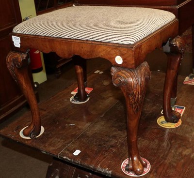 Lot 1307 - A George I style walnut dressing stool, with drop in seat, on carved cabriole legs and scrolled...