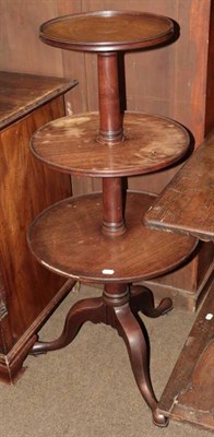 Lot 1310 - A George III mahogany three-tier dumb waiter (a.f.)