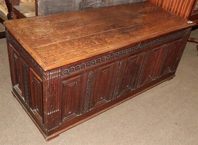 Lot 1316 - A late 17th/early 18th century joined oak chest with hinged lid and five moulded panels between...