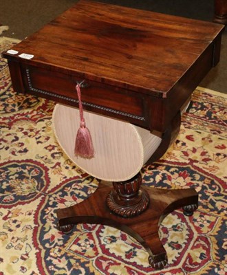 Lot 1317 - A Victorian rosewood work table with sliding silk work box below