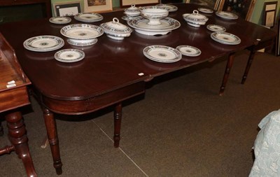 Lot 1325 - A mahogany D-end dining table, early 19th century, with reeded edge above a plain frieze, on turned