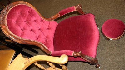 Lot 1337 - A Victorian carved mahogany framed button back open armchair and footstool upholstered in...