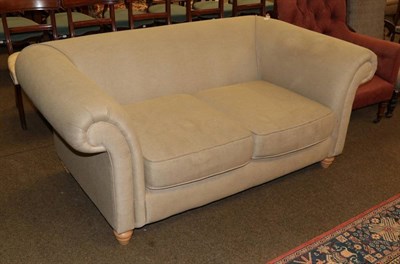 Lot 1341 - A two seater Chesterfield style sofa (modern) upholstered in beige fabric