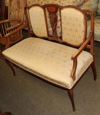 Lot 1350 - A late Victorian/Edwardian sofa upholstered in cream fabric