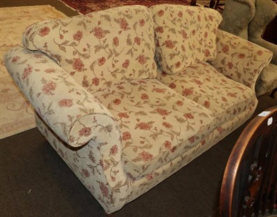 Lot 1351 - A two seater sofa (modern) covered in floral fabric