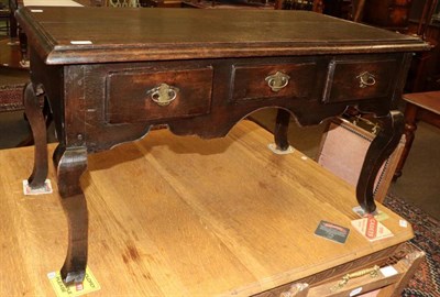 Lot 1353 - An 18th century low boy, fitted with three drawers, on cabriole supports