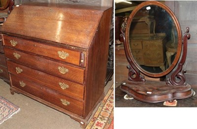 Lot 1365 - A George III oak bureau and a Victorian mahogany toilet mirror (2)