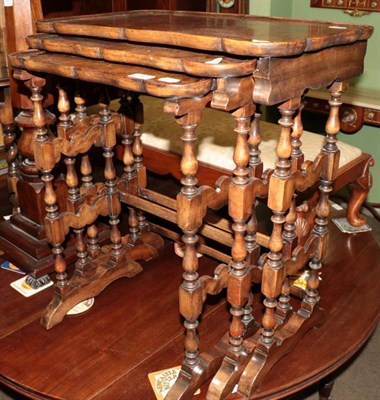 Lot 1369 - A nest of three burr walnut nesting tables