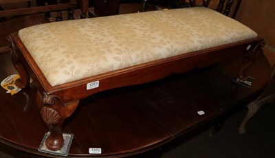 Lot 1373 - A late 19th/early 20th century mahogany double footstool with drop in seat and shell carved...