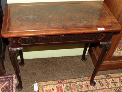 Lot 1382 - A carved mahogany side table, 18th century and later adapted