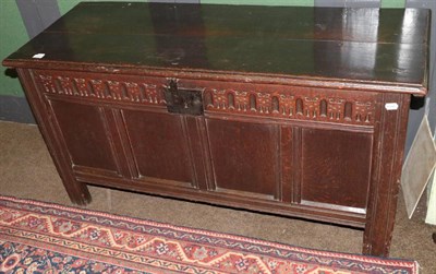 Lot 1383 - A late 17th century joined oak chest with hinged lid and nulled frieze