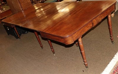 Lot 1386 - A George III mahogany extending dining table, circa 1820 with two extra leaves