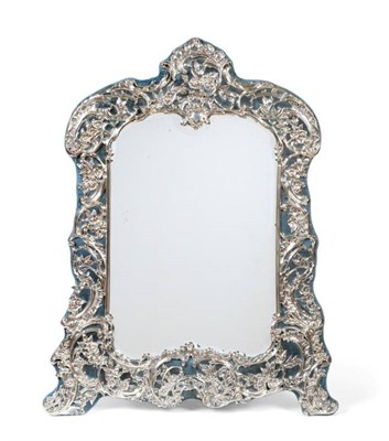 Lot 31 - ~ A Large Edwardian Silver Dressing Table Mirror, William Comyns, London 1906, of rococo influence
