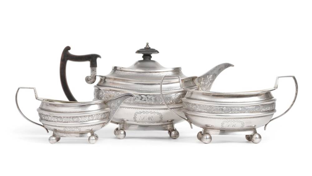 Lot 43 - A George III Silver Three Piece Tea Service, Robert & Samuel Hennell, London 1810, squat oval, with