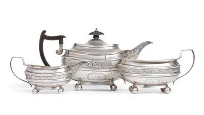 Lot 43 - A George III Silver Three Piece Tea Service, Robert & Samuel Hennell, London 1810, squat oval, with