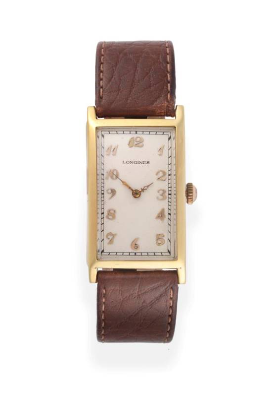 Lot 63 - An Art Deco 18ct Gold Curved Rectangular Wristwatch, signed Longines, 1925, (calibre 10.30)...