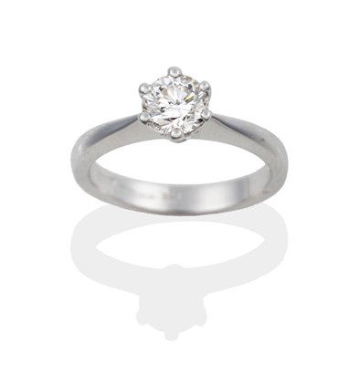 Lot 95 - An 18 Carat White Gold Diamond Solitaire Ring, the round brilliant cut diamond in a six claw...