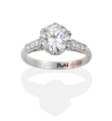 Lot 99 - A Diamond Solitaire Ring, the round brilliant cut diamond in a white six claw setting, to...
