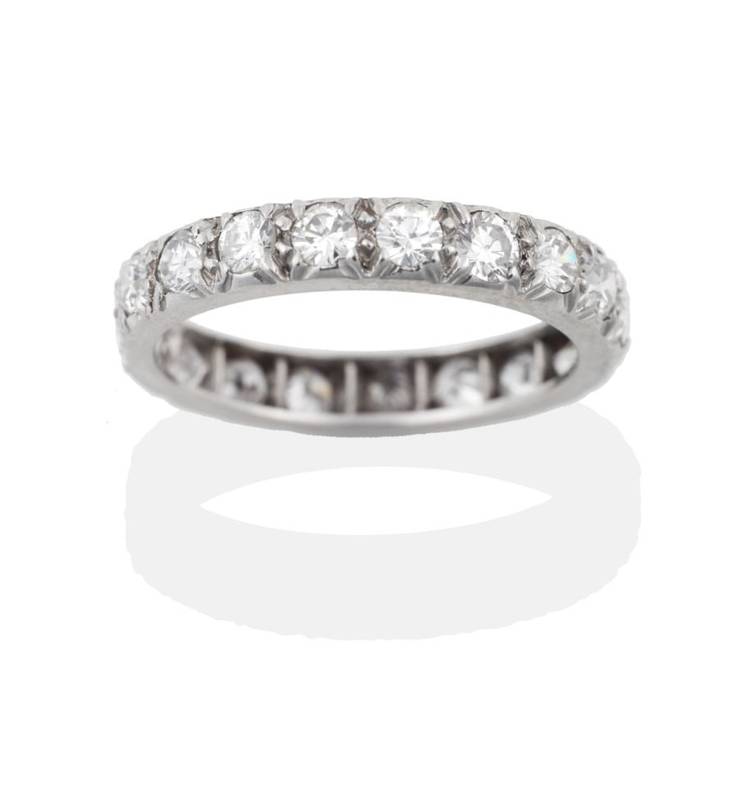 Lot 101 - A Diamond Eternity Ring, the round brilliant cut diamonds in white claws, total estimated...