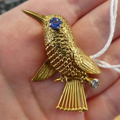 Lot 110 - ^ A 1960's Sapphire and Diamond Novelty Bird Brooch, by Cartier, modelled perched on a branch, with