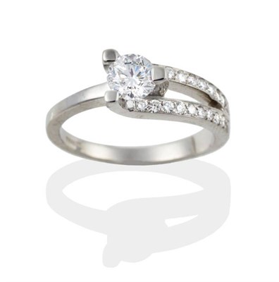 Lot 119 - A Platinum Diamond Ring, the round brilliant cut diamond in three claws, asymmetrically set to...