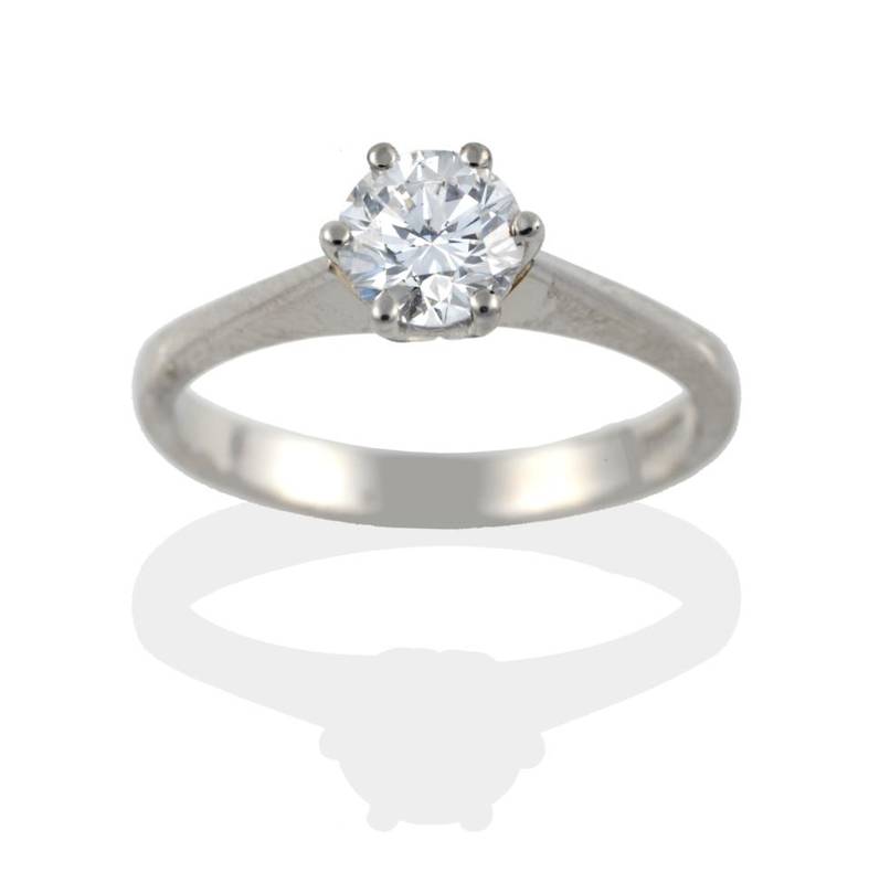 Lot 120 - A Platinum Diamond Solitaire Ring, the round brilliant cut diamond in a six claw setting, to a...