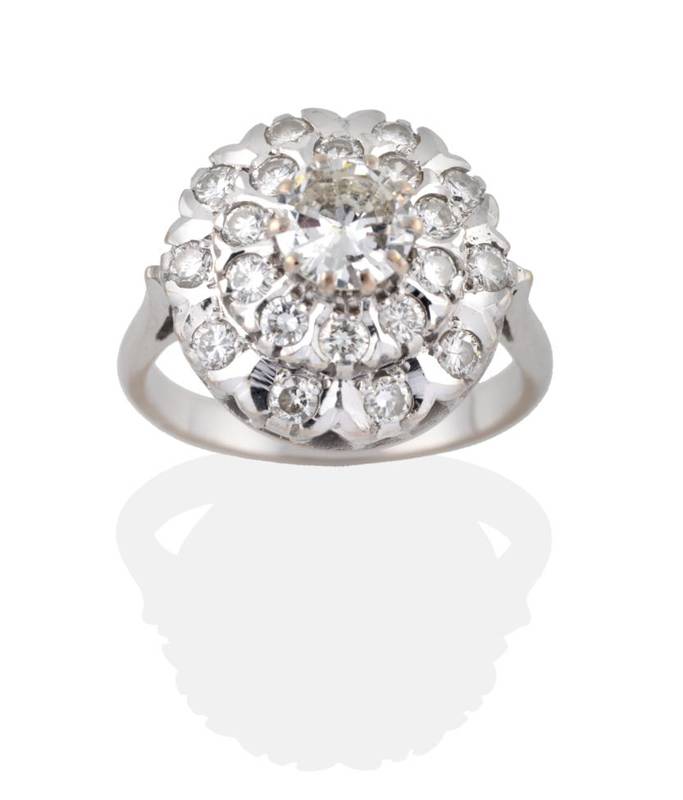 Lot 132 - A Diamond Cluster Ring, a round brilliant cut diamond sits above two rows of round brilliant...