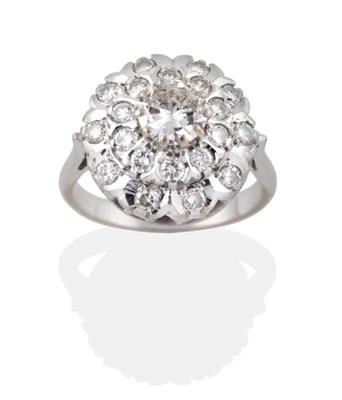 Lot 132 - A Diamond Cluster Ring, a round brilliant cut diamond sits above two rows of round brilliant...