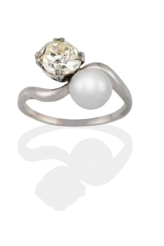 Lot 143 - A Cultured Pearl and Diamond Crossover Ring, the cushion cut diamond in a white double claw...
