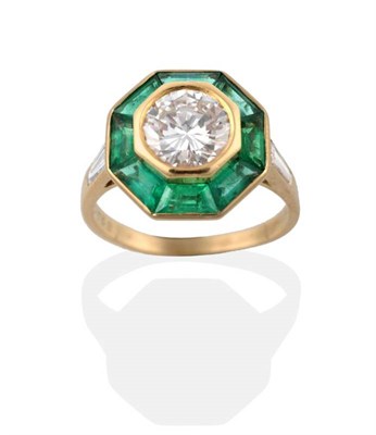 Lot 146 - ^ A Diamond and Emerald Cluster Ring, by Mellerio, a round brilliant cut diamond within an...