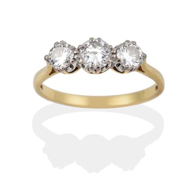 Lot 150 - An 18 Carat Gold Diamond Three Stone Ring, the round brilliant cut diamonds in white claw...