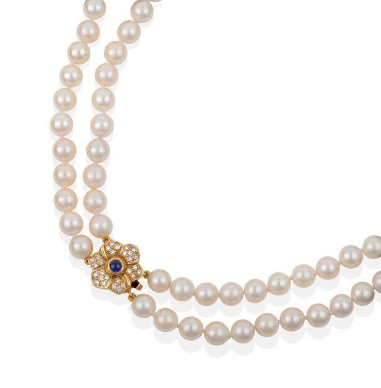 Lot 153 - A Cultured Pearl Two Row Necklace, the pearls knotted to an 18 carat gold floral design...