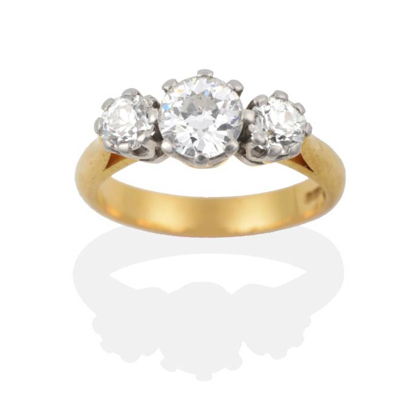Lot 156 - A 22 Carat Gold Diamond Three Stone Ring, the old cut diamonds in white claw settings on a...